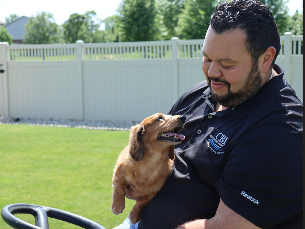 A CCCDI certified inspector for Chicago Backflow and his dog