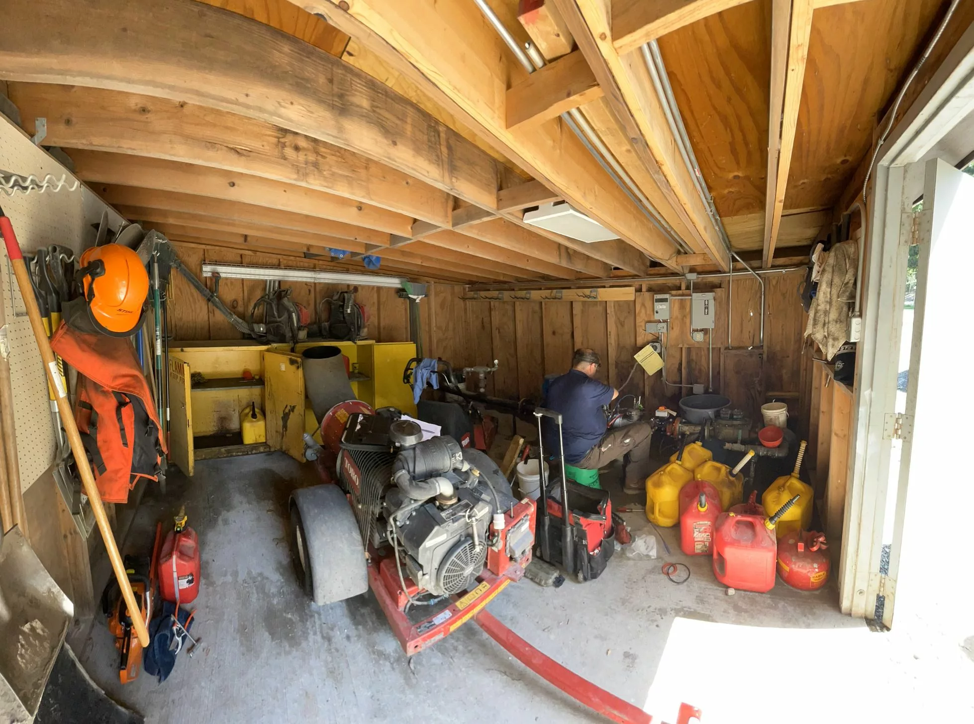 A Chicago backflow inc. tech works services a backflow device