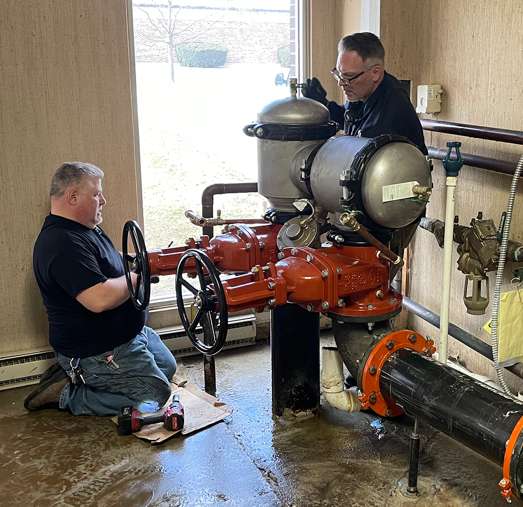 Two CBI techs Servicing a Backflow device in an Illinois park district