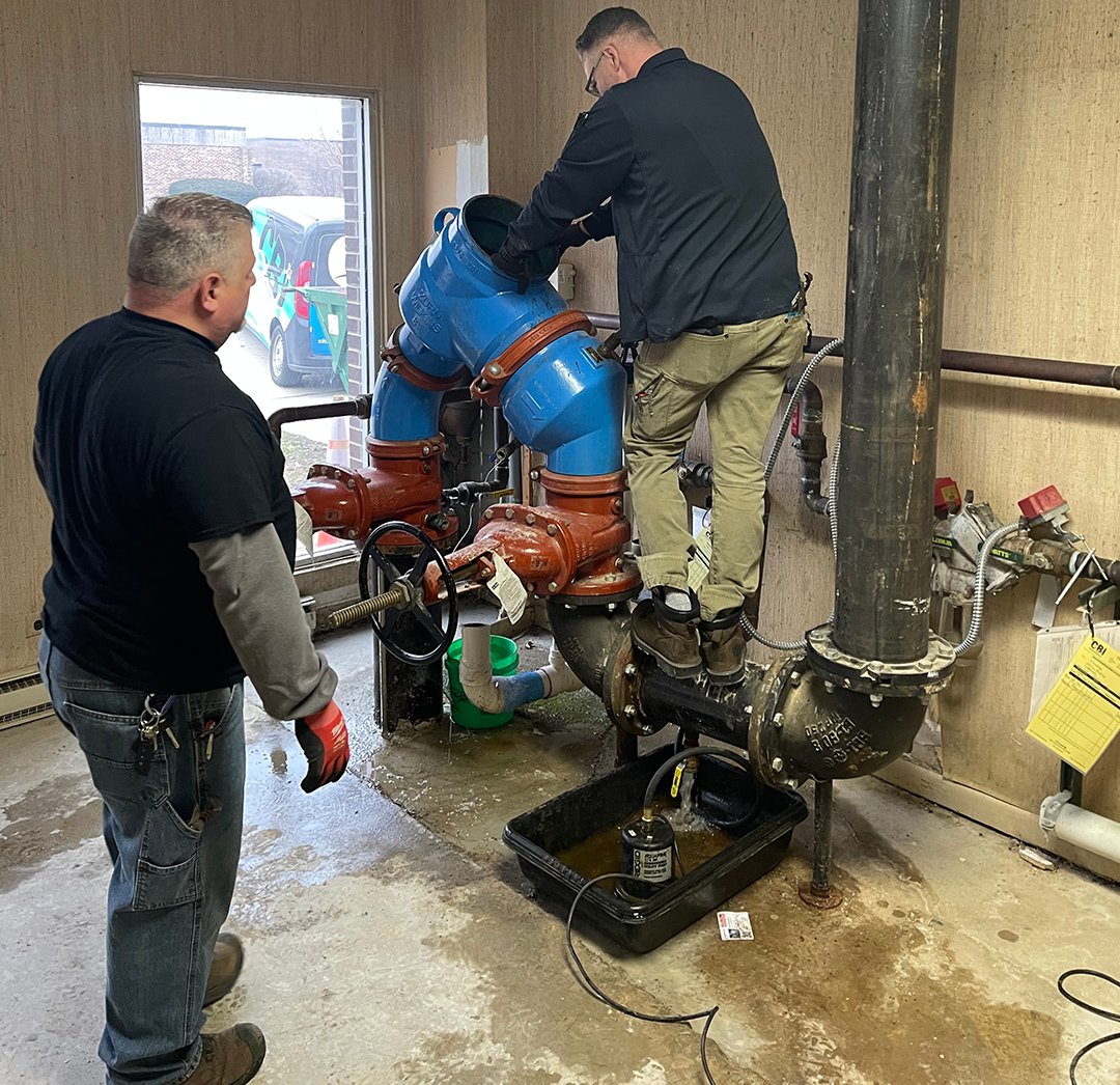 Two CBI techs Servicing a Backflow device in an Illinois park district